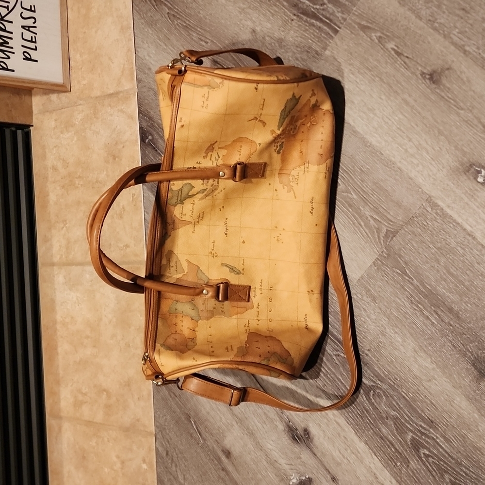 World map duffle bag. Like new. Never used. 20 inches long & 10 inches wide.